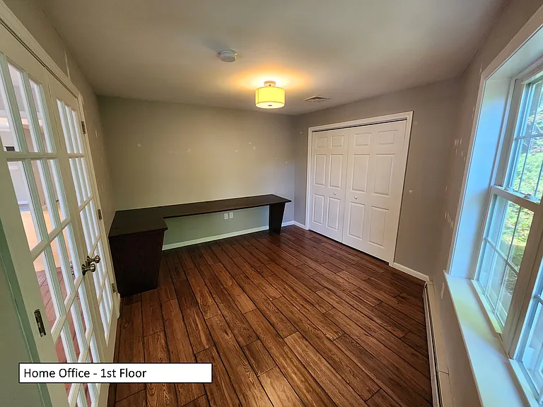 Office with built in desk and closet