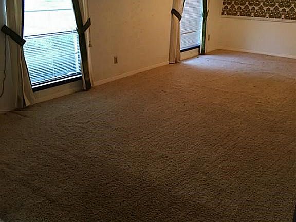 Ceiling to floor windows in living room provide great lighting