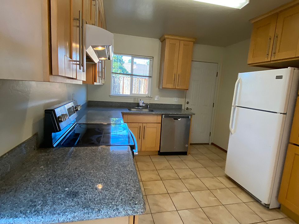 Kitchen with Granite Countertops and updated tile