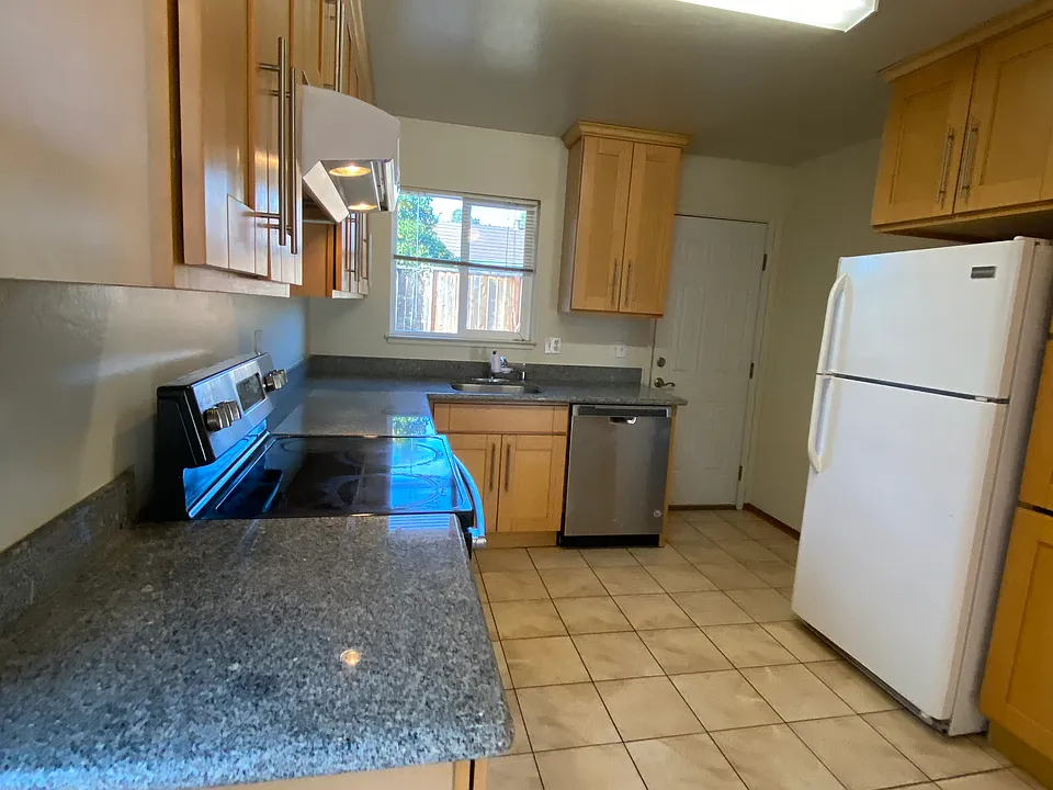 Kitchen with Granite Countertops and updated tile