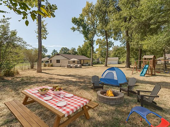 Endless possibilities in this almost half acre yard! Envision yourself enjoying the evenings in the peace of the woods, without sacrificing your amenities! Virtually staged