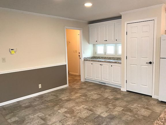 Dining area and cabinets from different angle. 