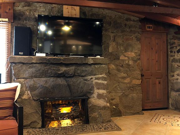 Massive fireplace and front door