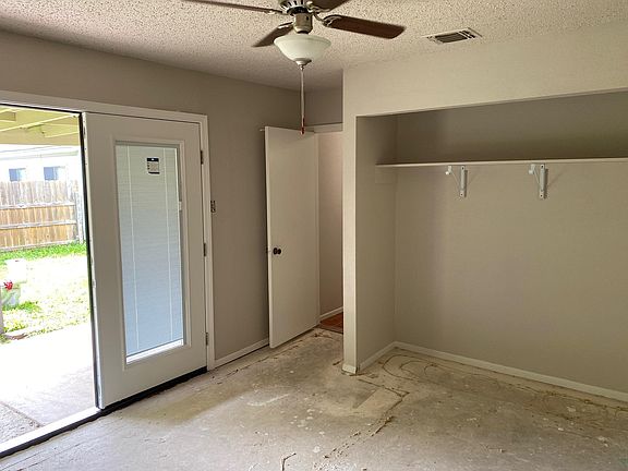 Master Bedroom with new French door to patio. We will be installing new vinyl wood plank floor in both bedrooms along with Modern Opaque Glass sliding closets doors