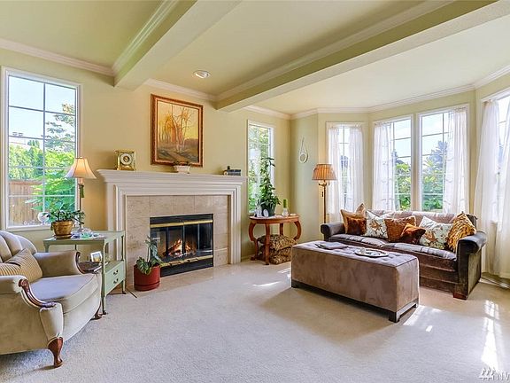 The wall of windows in the formal living room fills the space with natural light.