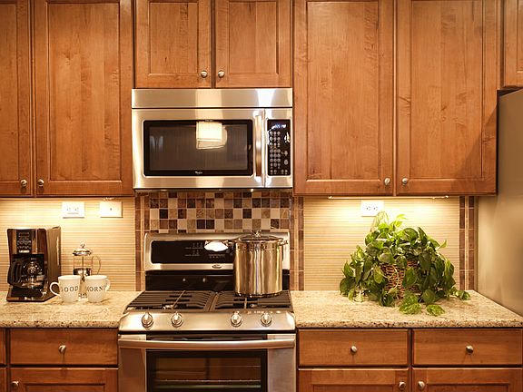 Whirlpool Stainless Steel and Maple Cabinetry in every kitchen