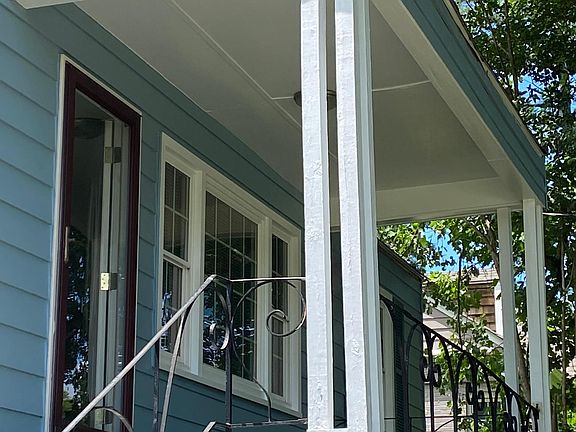 A few steps up to the covered front porch with a keypad deadbolt. Storm door gives lots of light while keeping pets and kids inside!