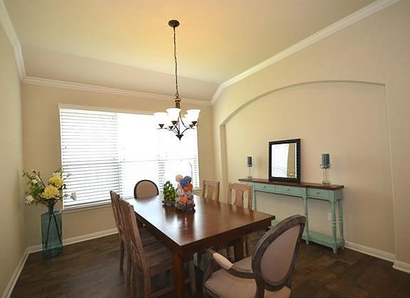 Throughout this home, you will find lovely architectural details such as this arched niche in the dining room.