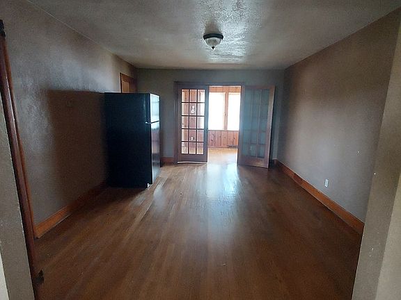 Dining room view from living room. Fridge has since been moved to kitchen
