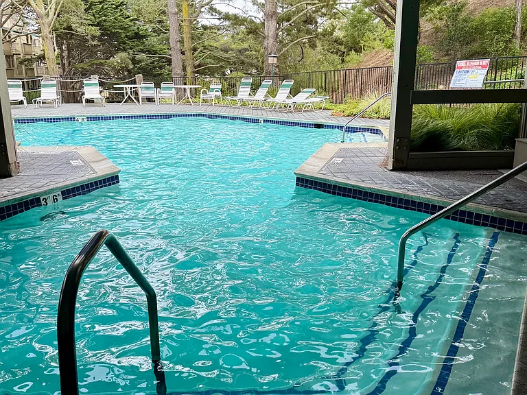 The indoor/ outdoor heated pool entrance also features accessible handrails.