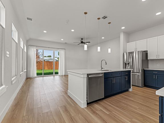 Open concept design and high ceilings throughout the home makes this 2000+ sq ft home feel even larger!