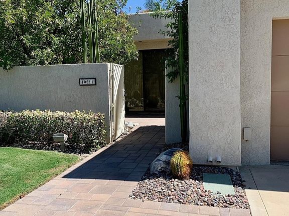 Enter the home through a well manicured courtyard.