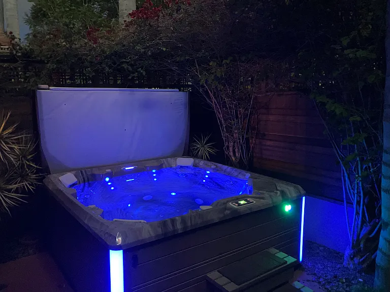 Outside Fenced Private Tropical Patio with Luxurious Hot Tub with Lighting and Bluetooth Speakers