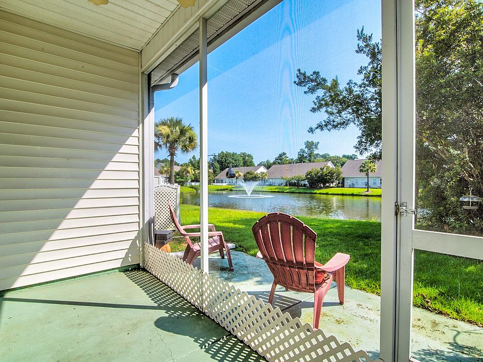 screened porch overlooking a lovely large pond