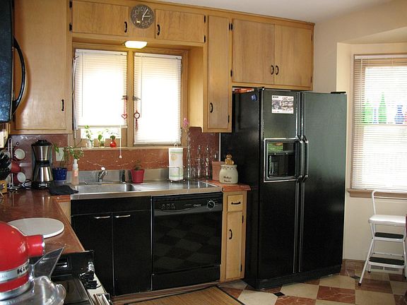 Kitchen with Marble counters and tile floor