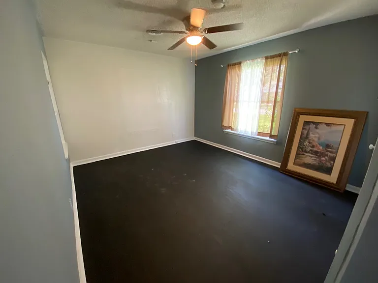 View of second bedroom from hallway door. The picture has been removed.