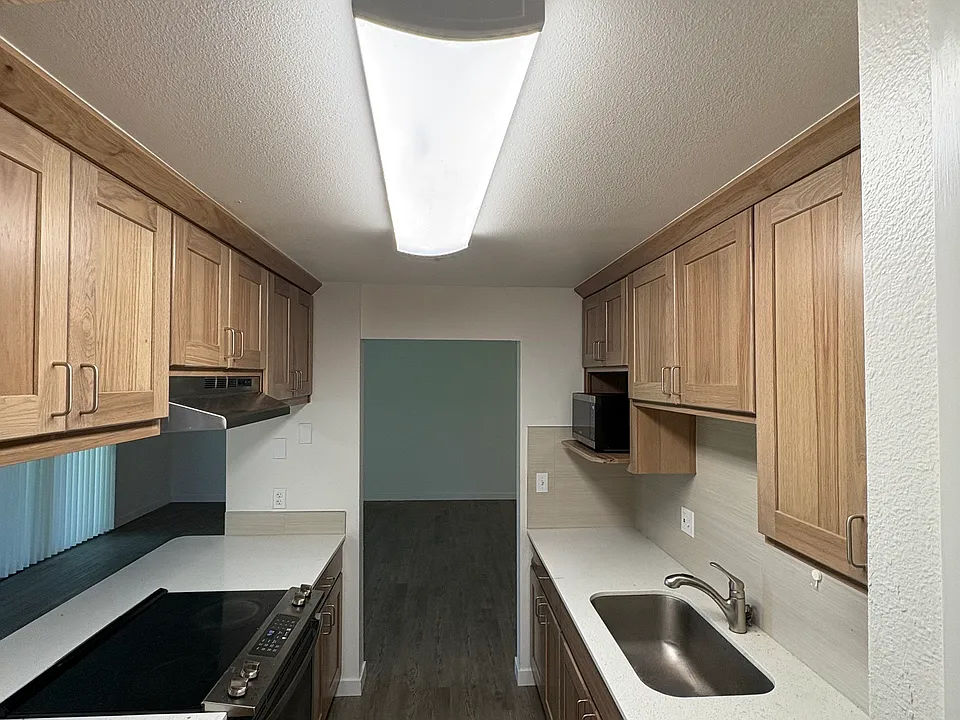 Updated cabinetry, appliances and flooring throughout