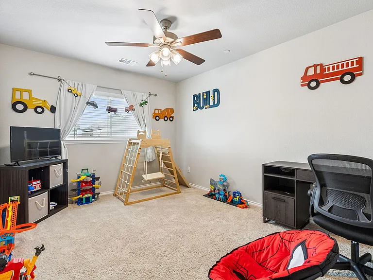 secondary bedroom with large walk in closet