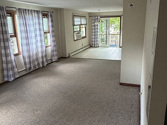 Living room is carpet, dining room w/kitchen is tile.