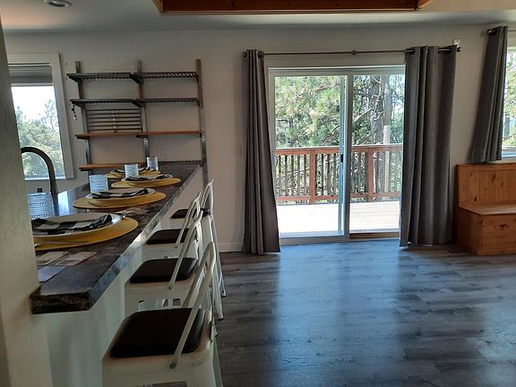 Eat at bar between kitchen and dinning room. Slider leads to upper deck.