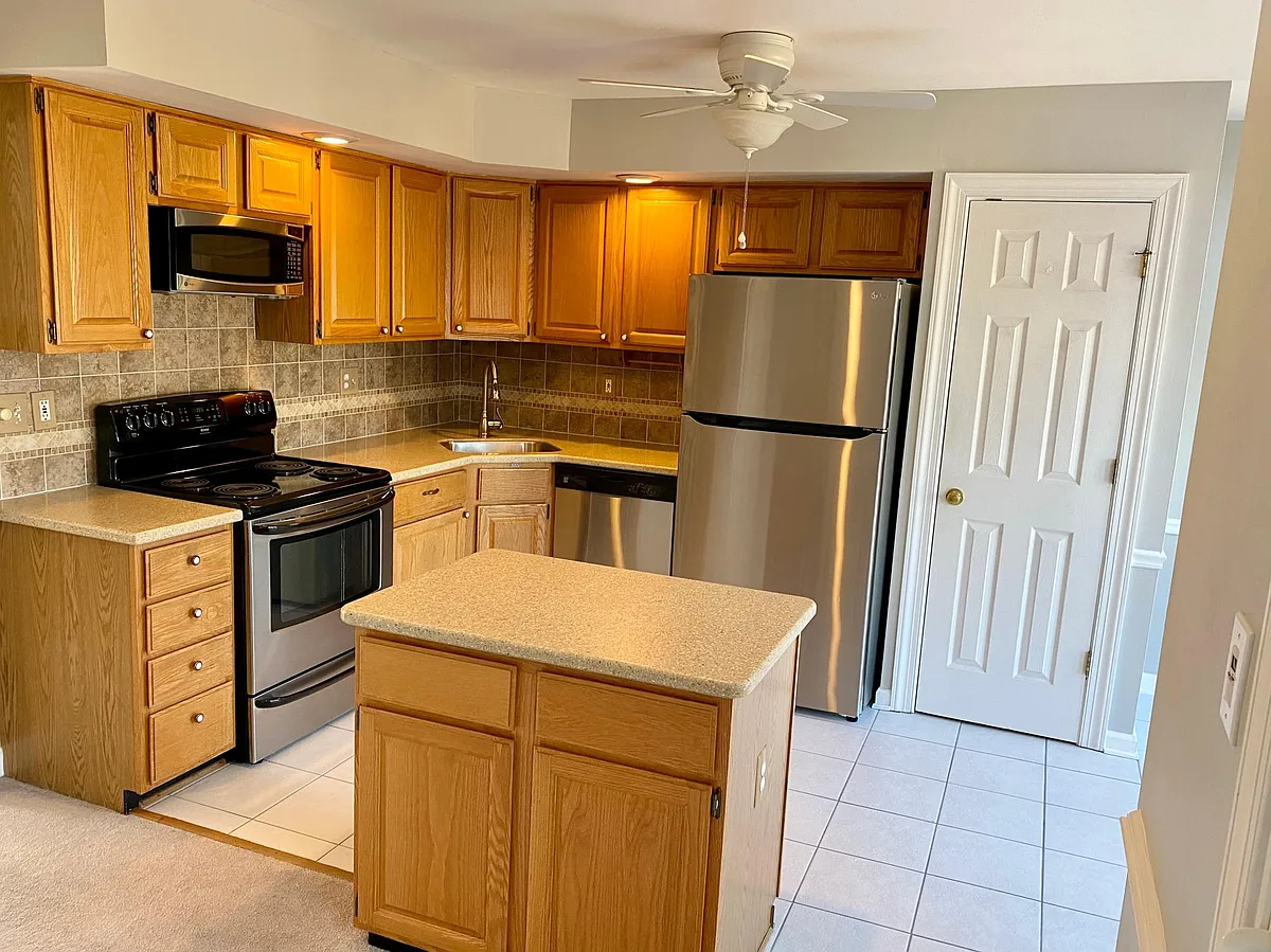 Kitchen with island and pantry. - 4214 Southfield Dr
