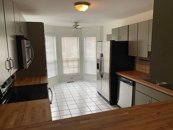 Kitchen - Lots of storage and counter space with new butcher block countertops. 
Bay window - fits a little bistro table.