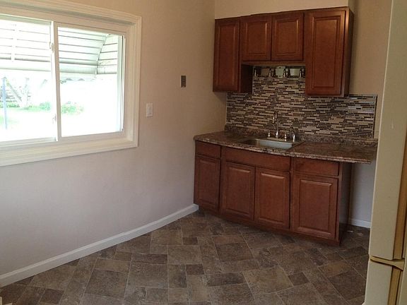 New kitchen with glass tile back splash