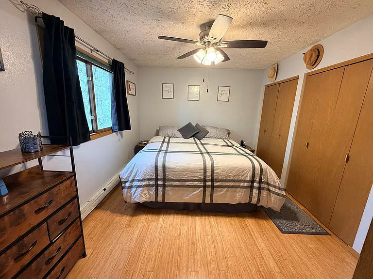 Master bedroom with king size bed, and large closet