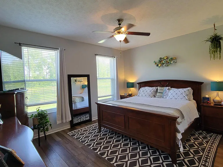 Master bedroom Cal King bed back of house