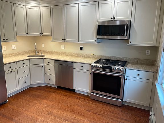 Stainless steel appliances including dishwasher.