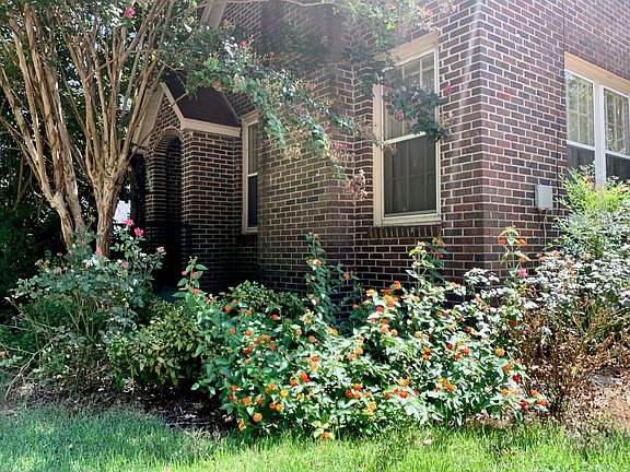Front view with shrubbery