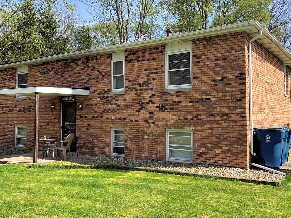 Beautiful brick exterior with covered porch that leads to interior entryway.