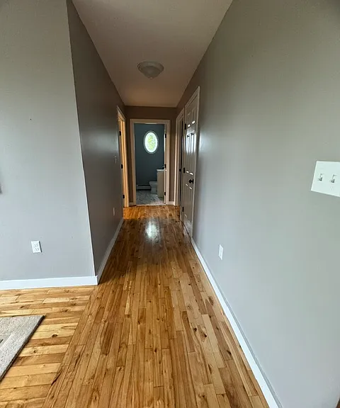 Hallway off Dining room leads to Bedroom 2 & 3 and second Bedroom