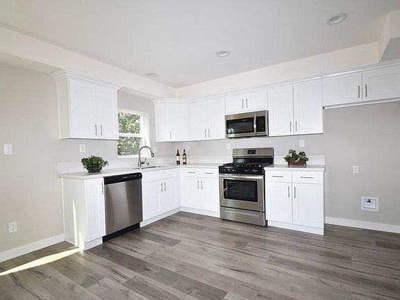 Modern Kitchen Featuring Shaker Styler Cabinets (refrigerator not pictured).