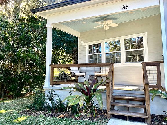 Porch has view of lake and garden