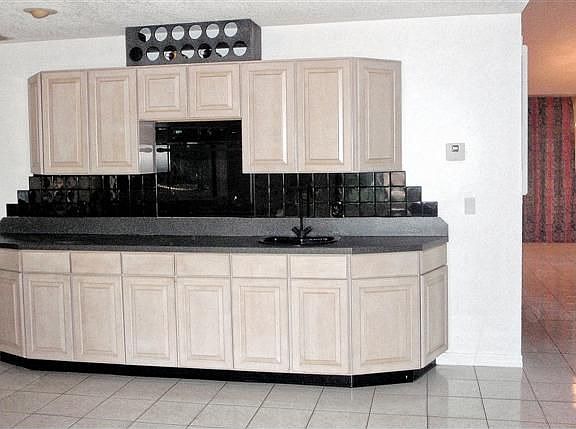 Back of kitchen.  Has salad sink and small wine rack.