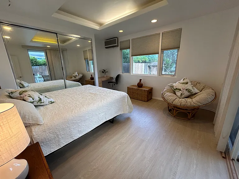 Fourth bedroom with high ceilings & soffit lighting facing backyard & pool