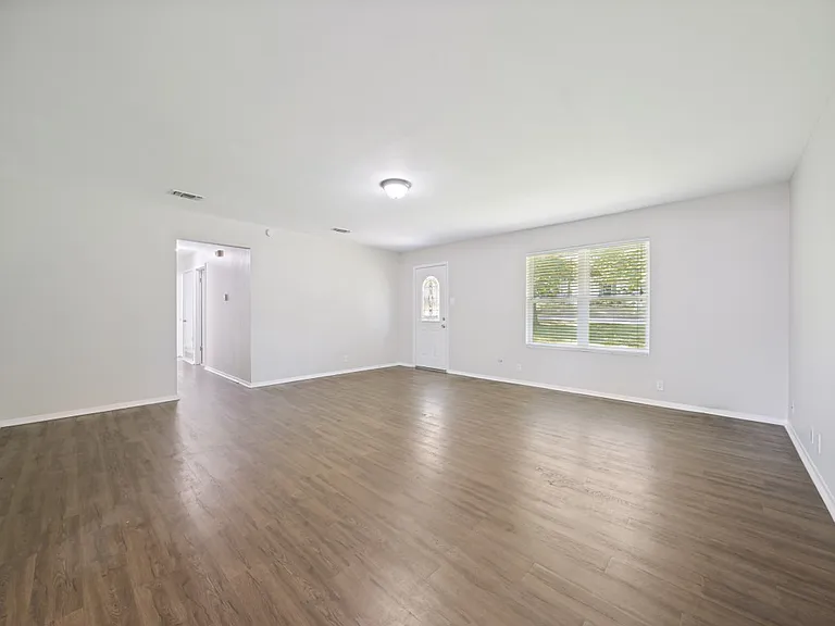 Another view of living area, hall view to bedrooms