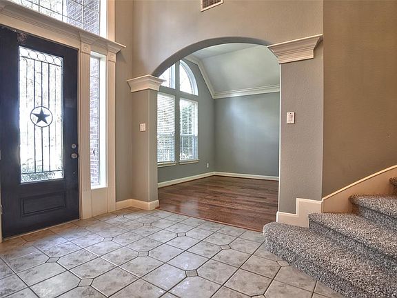2-story Grand Entry with Living room in background.