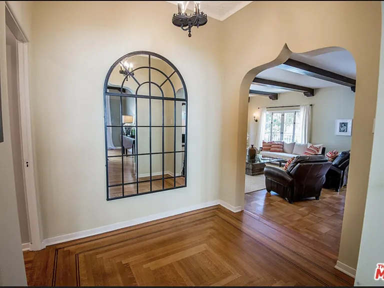 in bedroom foyer between hall leading to bedrooms, dining room and living room