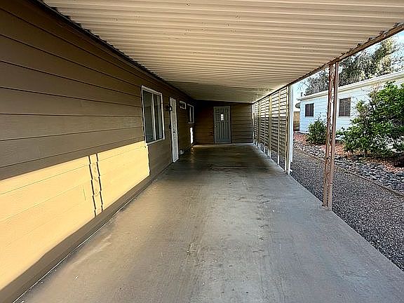 Carport with storage room
