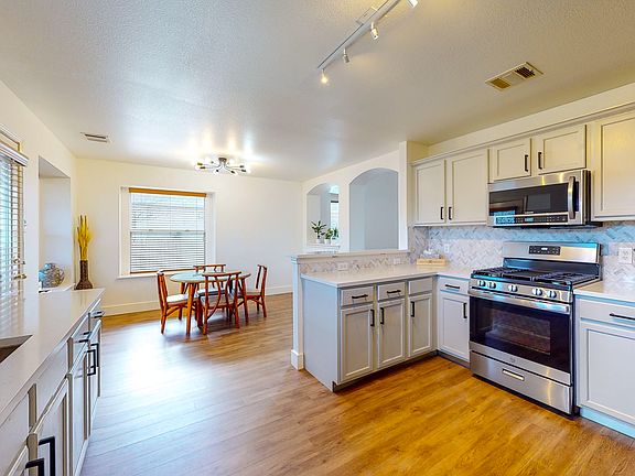 Remodeled kitchen with plenty of cabinet space and stainless steel applainces
