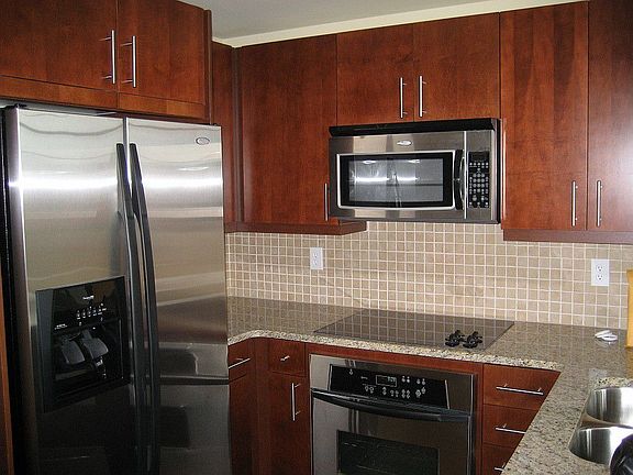 Gourmet kitchen with granite countertops and stainless steel appliances