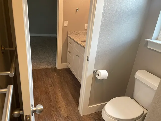 Two sinks, toilet and tub/shower combo.