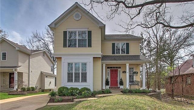 Large box window. Brick edging on threshold and front porch.