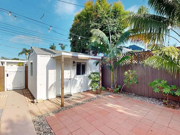 Far right is the entry gate into the interior of the yard as seen from the patio, and the "casita"