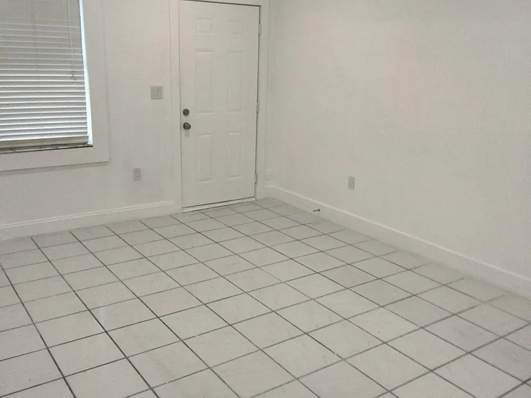 FRONT ENTRY INTO LIVING ROOM