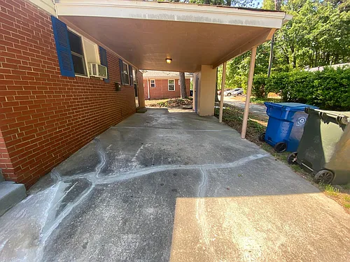 Private carport, in-unit laundry, and the Lakewood strip right outside your door. Photo 1