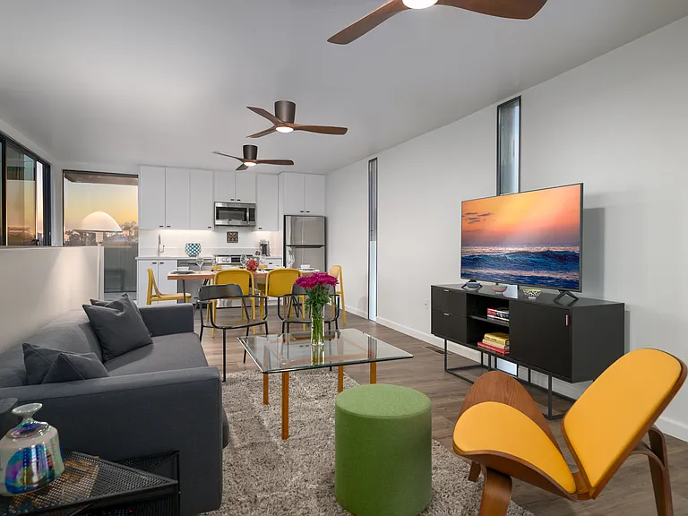 Great room with media cabinet, flat screen.