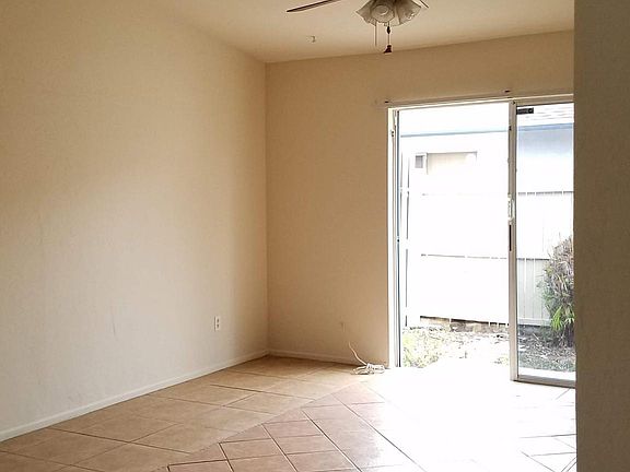 living room with slider leading to private patio area